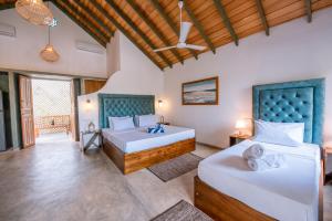 a bedroom with two beds in a room at Sithagi River Front Villa Weligama in Weligama +31 photos