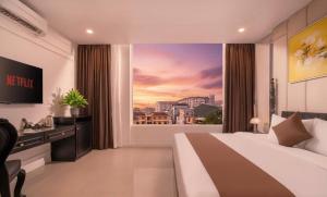 En eller flere senge i et værelse på The Elegant Boutique - Hue