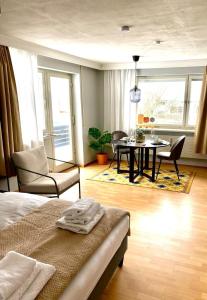 a bedroom with a table and chairs and a dining room at FeWo Alpsee Hornweg in Immenstadt im Allgäu