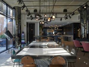 a large dining room with a long table and chairs at Tribe Perth Kings Park in Perth