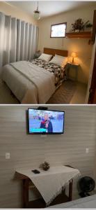 a bedroom with a bed and a tv on a wall at Casas e suites Temporada Tiradentes in Tiradentes