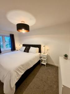 Postel nebo postele na pokoji v ubytování Cosy 4-Bed Buckshaw Village - Parking - Pets