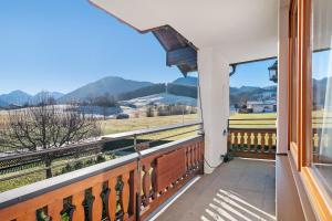 a balcony with a view of the mountains at Wohnung Hochfelln in Ruhpolding