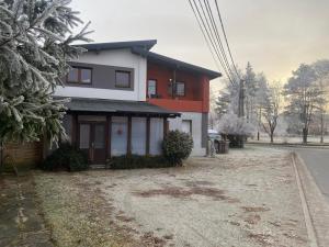 a house that is on the side of the road at Studio JAVOR pod Tatrami in Jezersko