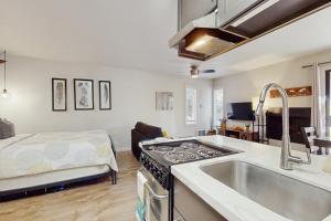 a kitchen with a sink and a stove at Cozy Kings Run Condo in Kingswood Estates +8 photos