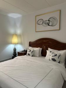 Giường trong phòng chung tại Le Bungalow by Mk