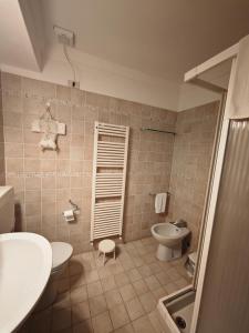 a bathroom with a sink and a toilet at Cascina Montalbano in Rosignano Monferrato +36 photos