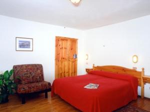 Een bed of bedden in een kamer bij Hotel Florian