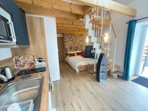 a small room with a bed and a bedroom at Kervel et Lokorn in Locronan +13 photos