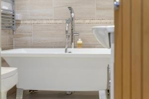 a bathroom with a sink and a toilet at 2 Bed in Fowey oc-r30265 in Fowey +18 photos