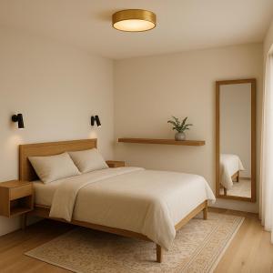 En eller flere senge i et værelse på Hotel Carmen