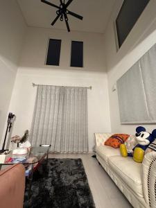 a living room with a couch and a glass table at any one in Chitose +10 photos