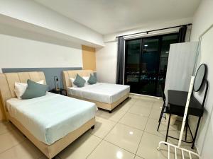 Postel nebo postele na pokoji v ubytování MUUJI Lodge-Juru Sentral Icon City + 14 fotografií