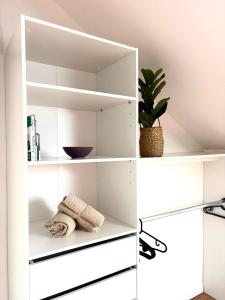 Kuchyň nebo kuchyňský kout v ubytování La Mansarde - Appartement cosy de 2 chambres