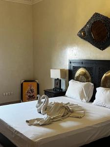 Ένα ή περισσότερα κρεβάτια σε δωμάτιο στο Villa Oum Palace