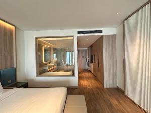 Postel nebo postele na pokoji v ubytování À La Carte Hạ Long Teri Apartment