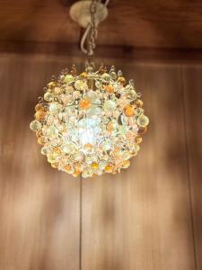 a chandelier hanging from a ceiling at Okayama Urban Peach in Okayama