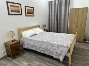 Postel nebo postele na pokoji v ubytování Micaelense Guest House