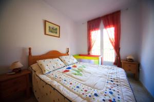 Łóżko lub łóżka w pokoju w obiekcie Holiday home MonteMar