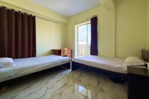 Ένα ή περισσότερα κρεβάτια σε δωμάτιο στο 中国公寓 Chinese Hotel +18 φωτογραφίες