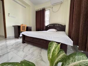 Ένα ή περισσότερα κρεβάτια σε δωμάτιο στο 中国公寓 Chinese Hotel