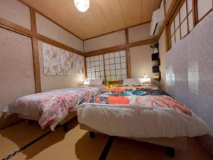 Postel nebo postele na pokoji v ubytování happy stay華 Kagawa Sakaide 1 Building Private 6 Guests Free