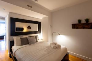 Ліжко або ліжка в номері Les Immeubles Charlevoix - Le 1173