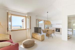a living room with a couch and a table with a tv at Casa Nouè in Tertenìa