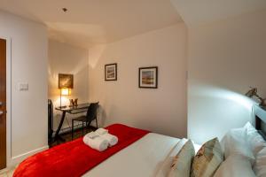 En eller flere senge i et værelse på Les Immeubles Charlevoix - Le 1174