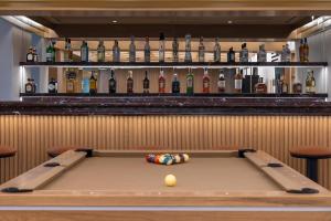 a pool table with a ball on it in a bar at The Stanley in Athens
