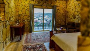 Postel nebo postele na pokoji v ubytování jabal shams view stay نزل إطلالة جبل شمس