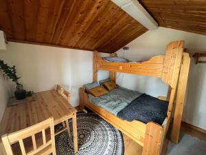 a room with two bunk beds and a table at Våmåbadets Camping in Våmhus +29 photos
