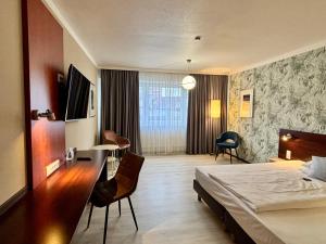 Postel nebo postele na pokoji v ubytování Best Western Hotel Ambassador