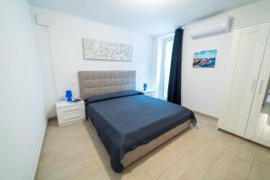 a small bedroom with a bed and a window at Golfo di Lacona in Lacona