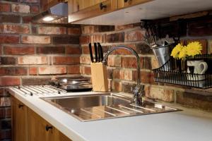 Kuchyňa alebo kuchynka v ubytovaní Apartman 105 Pec pod Sněžkou + 29 fotografií