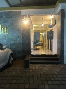 a store window with a car parked in front of it at La Mer Inn in Kozhikode +10 photos