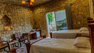 Postel nebo postele na pokoji v ubytování jabal shams view stay نزل إطلالة جبل شمس + 8 fotografií