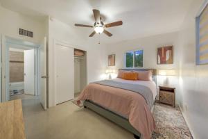 a bedroom with a bed and a ceiling fan at 24th St (Deepak & Jackie) in Tucson