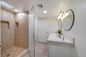 a bathroom with a sink and a shower at 24th St (Deepak & Jackie) in Tucson +26 photos