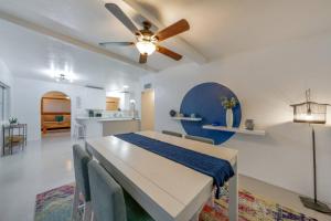 a bedroom with a bed and a ceiling fan at 24th St (Deepak & Jackie) in Tucson