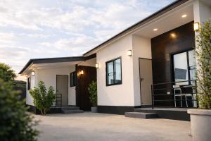 a modern house with black and white at ANNKAMii INN in Pai