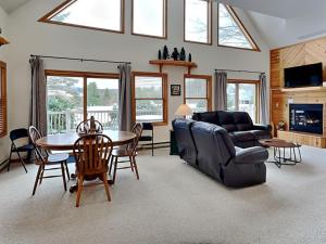 a living room with a couch and a table at Almost Heaven in Swanton +32 photos