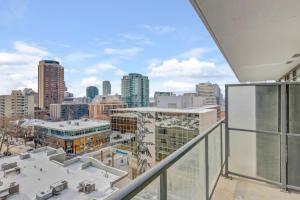 an apartment balcony with a view of a city at Spacious and Stylish Modern Condo in Calgary in Calgary