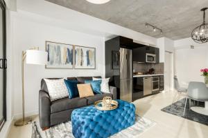 a living room with a couch and a table at Spacious and Stylish Modern Condo in Calgary in Calgary +33 photos