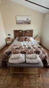 En eller flere senge i et værelse på Apartamento Rural Vainilla