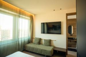 a living room with a chair and a window at Sicilias in Catania
