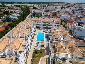 an aerial view of a city with houses and a swimming pool at Cabanas Beach T2 in Cabanas de Tavira