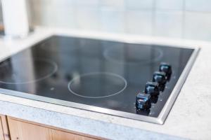 a remote control sitting on top of a counter at Appartement SONNENGLÜCK by MoniCare in Leutasch +15 photos