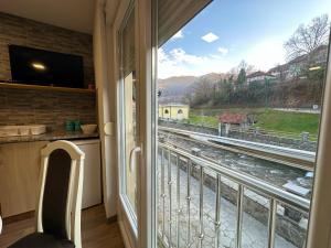 a window with a view of a train track at Urban Apartmens 5 in Jošanička Banja