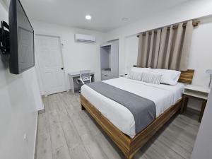 Postel nebo postele na pokoji v ubytování Margarita Lodge + 29 fotografií